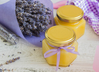 Lavender blossom honey. Lavender twigs in the background.