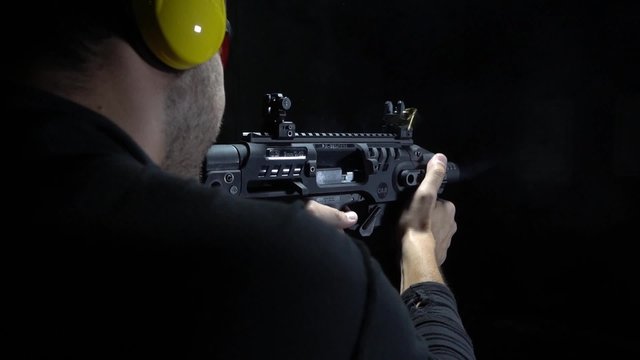 shooting bullets with gun in range