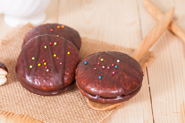 chocolate Sponge sandwich pie on wood table