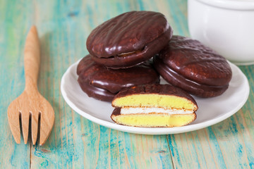 chocolate Sponge sandwich pie on wood table