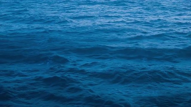 Rich Blue Caribbean Water Going By a Cruising Ship