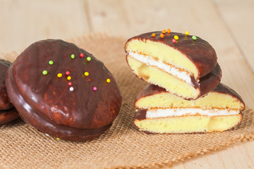 chocolate Sponge sandwich pie on wood table