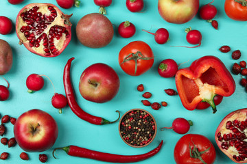 fruits and vegetables red flower scattered on blue wooden background