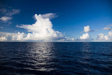 Naklejka na ściany i meble Wonderful clouds over the blue Indian Ocean