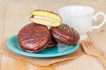 chocolate Sponge sandwich pie on wood table