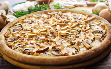 Pizza with meat and mushrooms