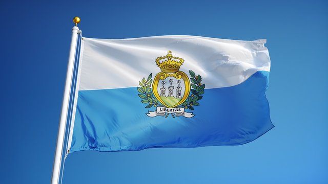 San Marino flag waving in slow motion against clean blue sky, seamlessly looped, close up, isolated on alpha channel with black and white luminance matte, perfect for film, news, digital composition