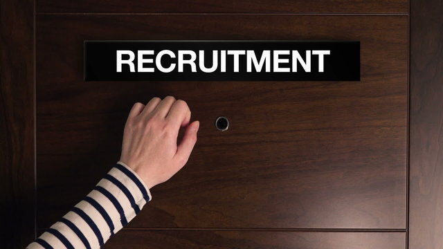 Female hand knocking on the Recruitment door, woman looking for job