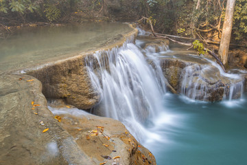 tropical waterfall in deep forest of Kanchanaburi province, Thailand.