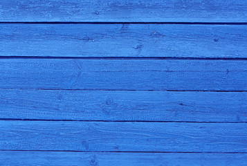 Weathered blue wooden surface.