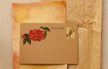 Postcard on aged paper with watercolor drawings