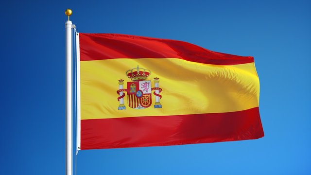 Spain flag waving in slow motion against clean blue sky, seamlessly looped, close up, isolated on alpha channel with black and white luminance matte, perfect for film, news, digital composition