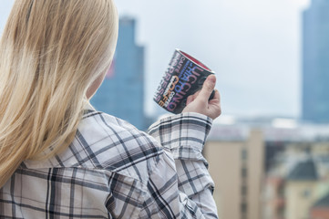 closeup portrait of young woman with coffee