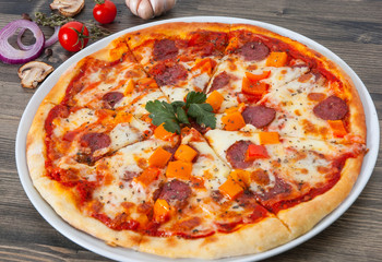 pizza with mushrooms, salami, vegetables