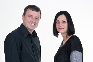 Portrait of couple isolated on white background. Mid aged