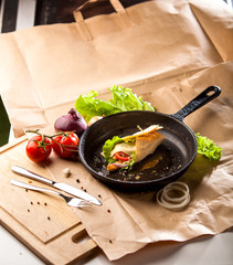 Home baked hot roll on a cast-iron pan 