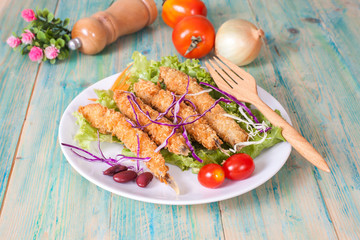 Fish fry in plate on wood desk