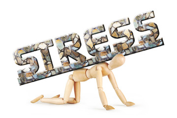 Man stands on his knees under the burden of emotional stress. Abstract image with a wooden puppet