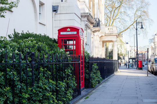 LONDON. Red telephone box on the  street.