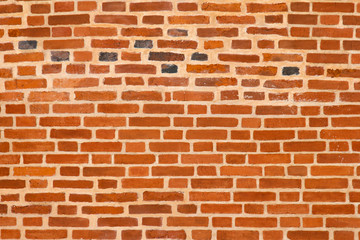 Old brick wall. Texture of wall from a red brick. The background of bricks. Brickwork of an ancient building.