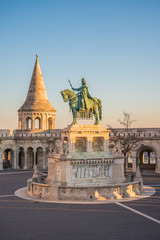 Obraz premium Saint Stefan Statue at Fisherman's Bastion, in Budapest, Hungary with Clear Blue Sky in Background at Sunrise
