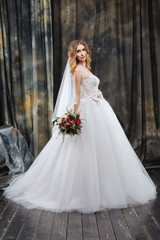 Fototapeta premium portrait of pretty bride in wedding dress
