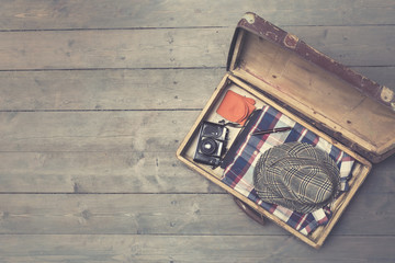 opened vintage suitcases with clothes and accessories. copy spac