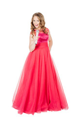 Obraz na płótnie Canvas Studio shot beautiful young singing girl in elegant red dress 