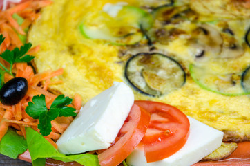 Scrambled eggs with cheese and vegetables © focusandblur