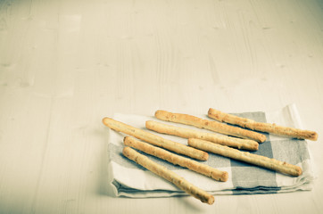 rustic breadsticks  on wood table, close up, background