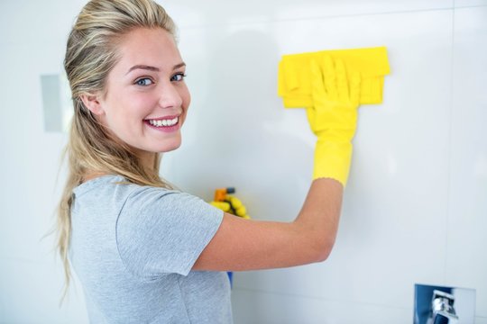 Woman Cleaning The Bathroom