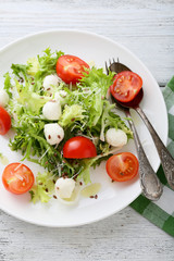 tomato salad with cheese on plate