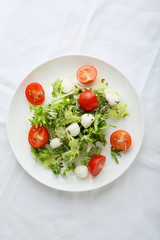 fresh salad on white plate