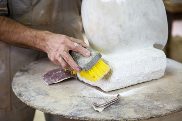 brushing dust from the marble sculptures up close © misalukic