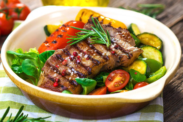 Grilled veal steaks with vegetables