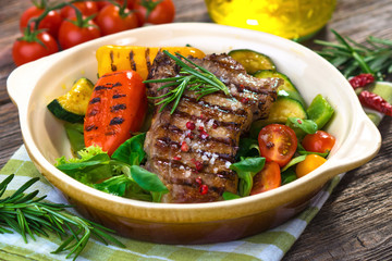 Grilled veal steaks with vegetables