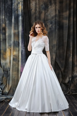 Fototapeta premium portrait of pretty bride in wedding dress