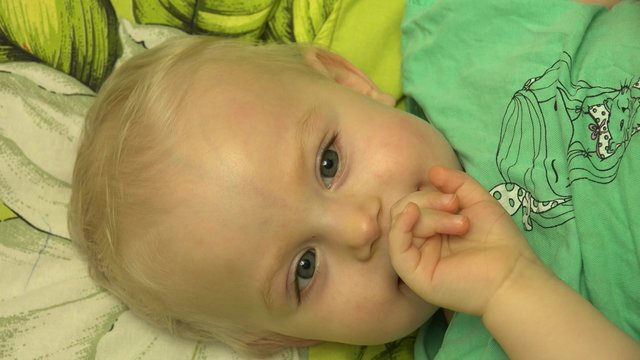 Father  Tickle his Baby in Bed. Closeup. 4K UltraHD video.