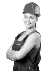 Smiling woman construction worker wearing helmet isolated on white