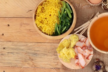 Egg noodles with pork and dumpling in soup.