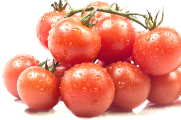 many small vine ripe tomato wet