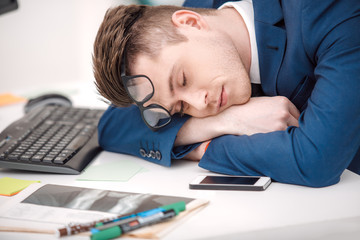 Naklejka premium Young businessman working in office
