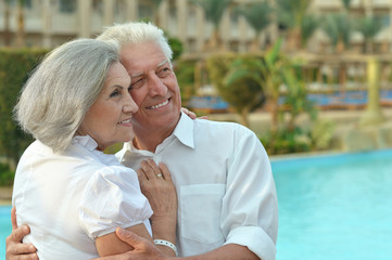 Senior couple near pool