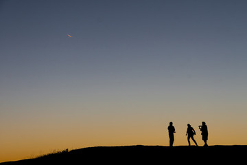 Silhouette of People at Sunset