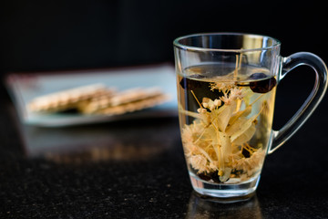 Cup of herbal tea with crackers