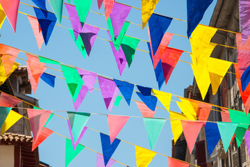 Colorful garlands decorating the streets of the city of Bayonne during the summer festival (fetes...