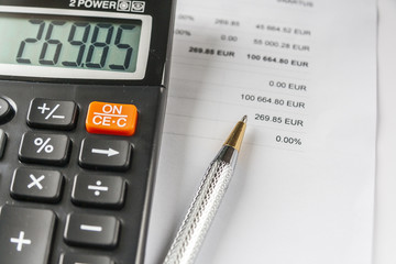 Calculator And Pen On Financial Document