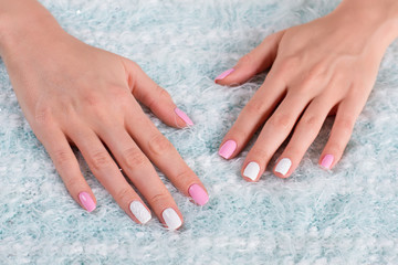 Female hands on a fluffy cloth.