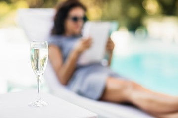 Close-up of champagne flute on side table