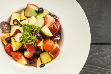 fruits salad in plate on table